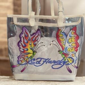 Ed Hardy Butterfly Artwork Clear
PVC Tote Bag, White Faux Leather Trim, NWT 🦋